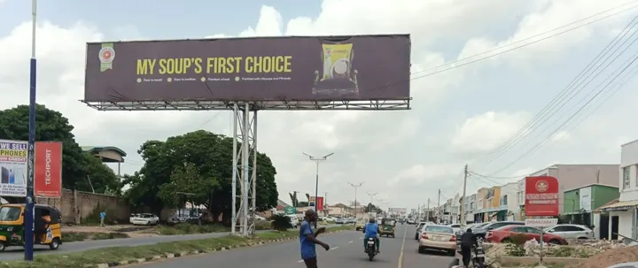 Golden Penny Semovita eyecatcher above a pedestrian crossing on Fate Road, Ilorin, for FMN