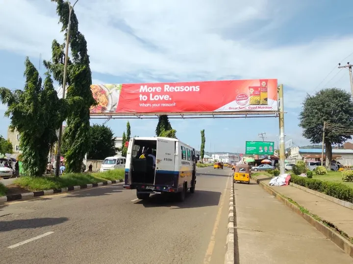 Golden Penny spaghetti gantry spanning a dual carriageway in Enugu, for FMN