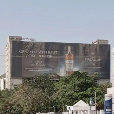 The Macallan Crafted Without Compromise wall drape high on a building in Abuja