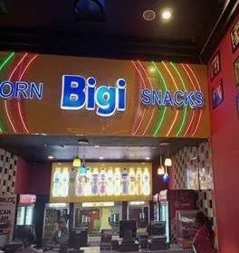 Lit Bigi Snacks counter sign with neon rings, made for Rite Foods